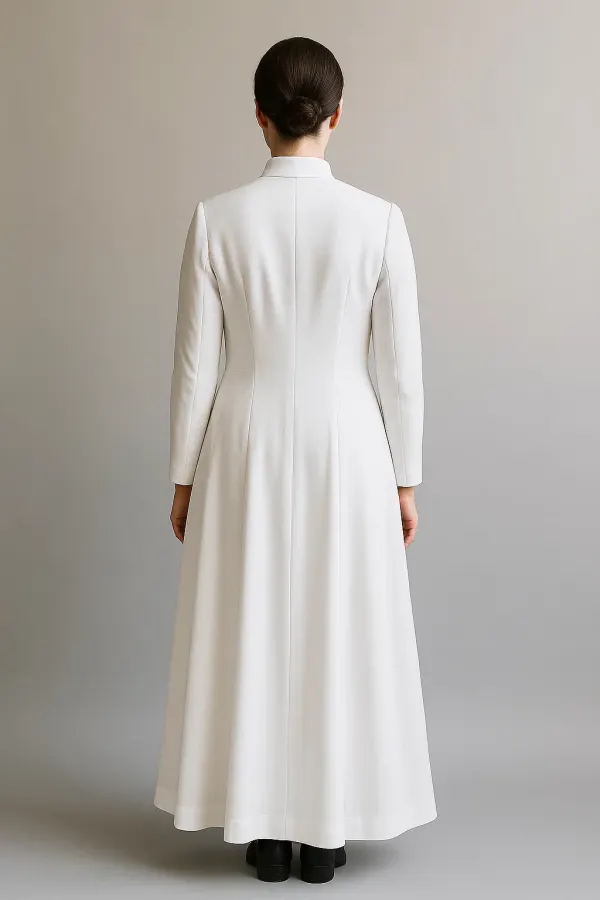 Long white women's clerical dress with a mandarin collar and a wide matching belt with tasseled fringe