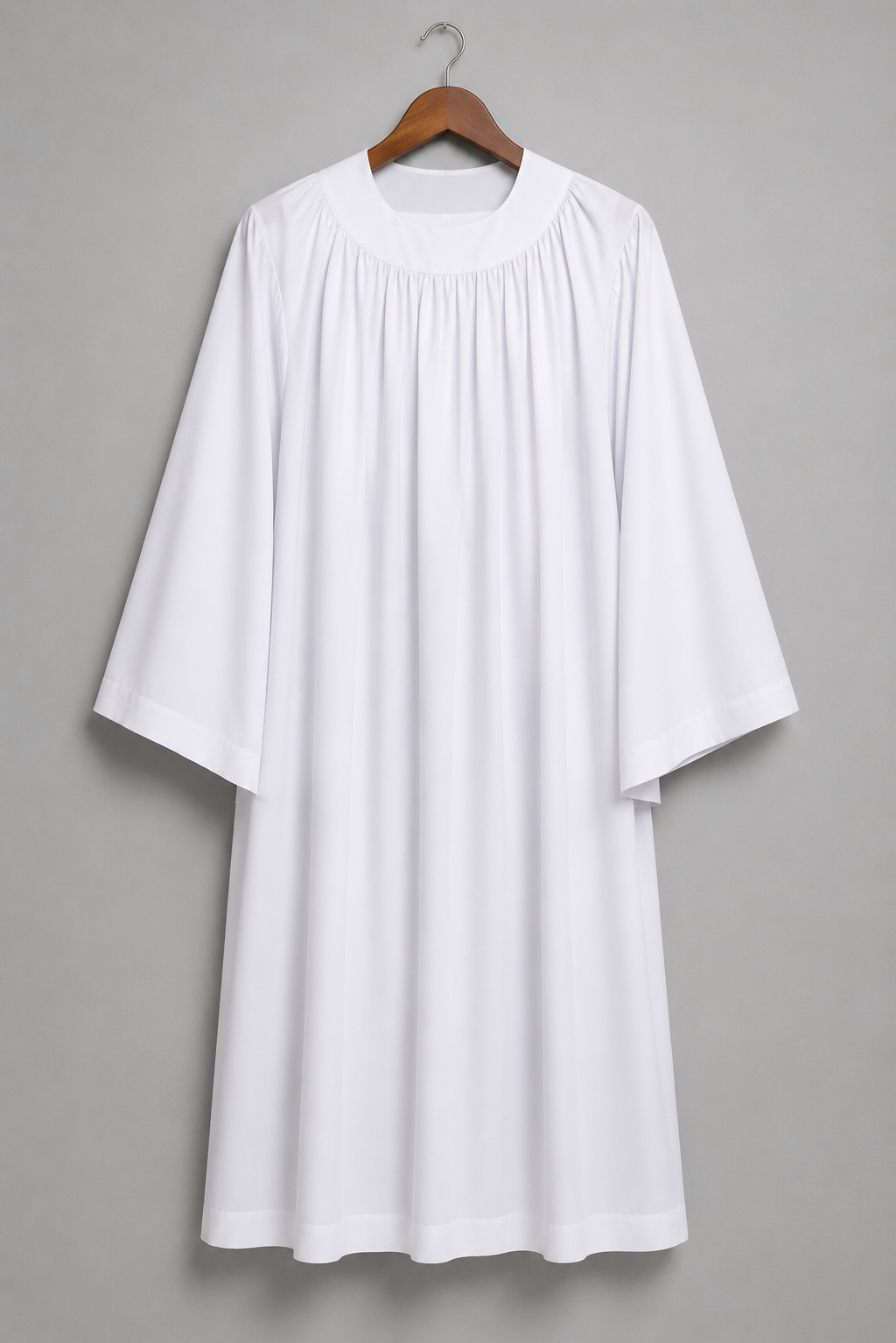 White men's clergy surplice with a gathered round yoke, worn over a black cassock