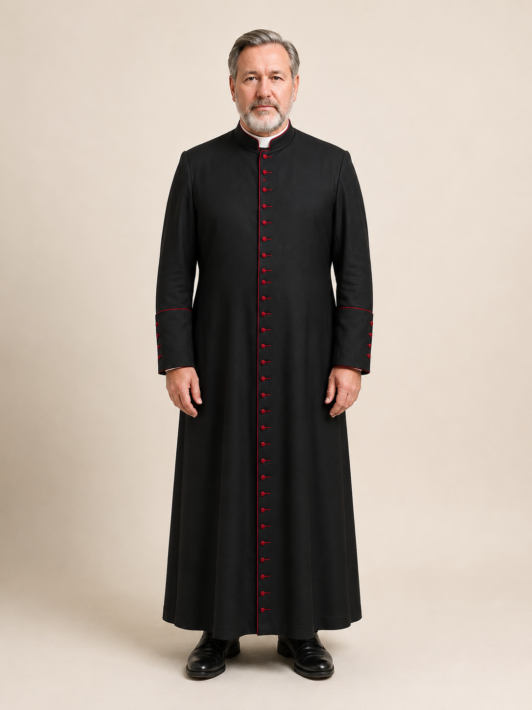 Black men's clergy cassock with red piping on the collar, cuffs, and placket, front view